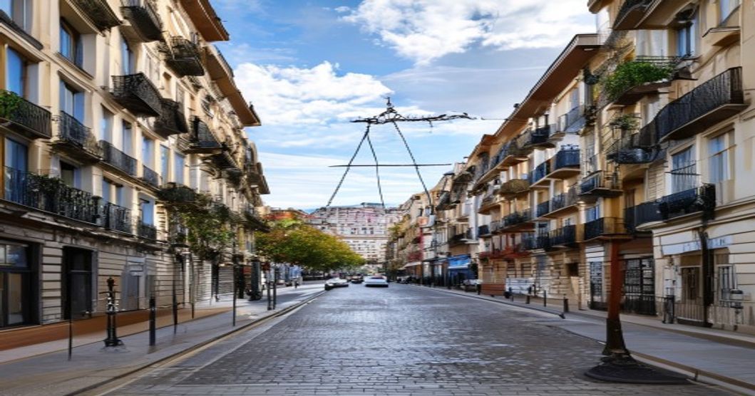 Madrid city street, legal scales, social housing